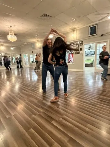 A couple mid-turn on the studio floor