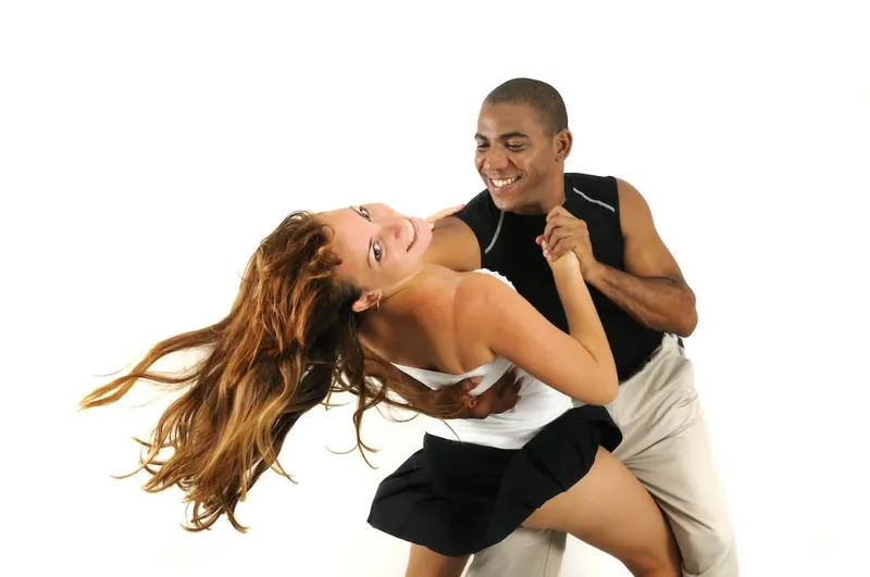A couple mid-turn in an energetic Latin routine
