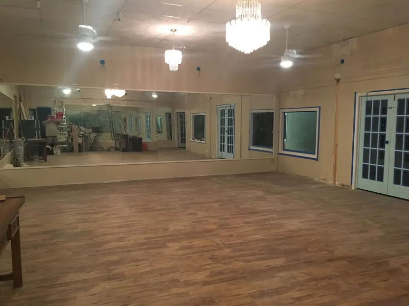 The empty studio floor and its chandeliers
